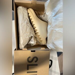 Men’s yeezy slides size 9 never worn. Brand new with tags. $500 OBO